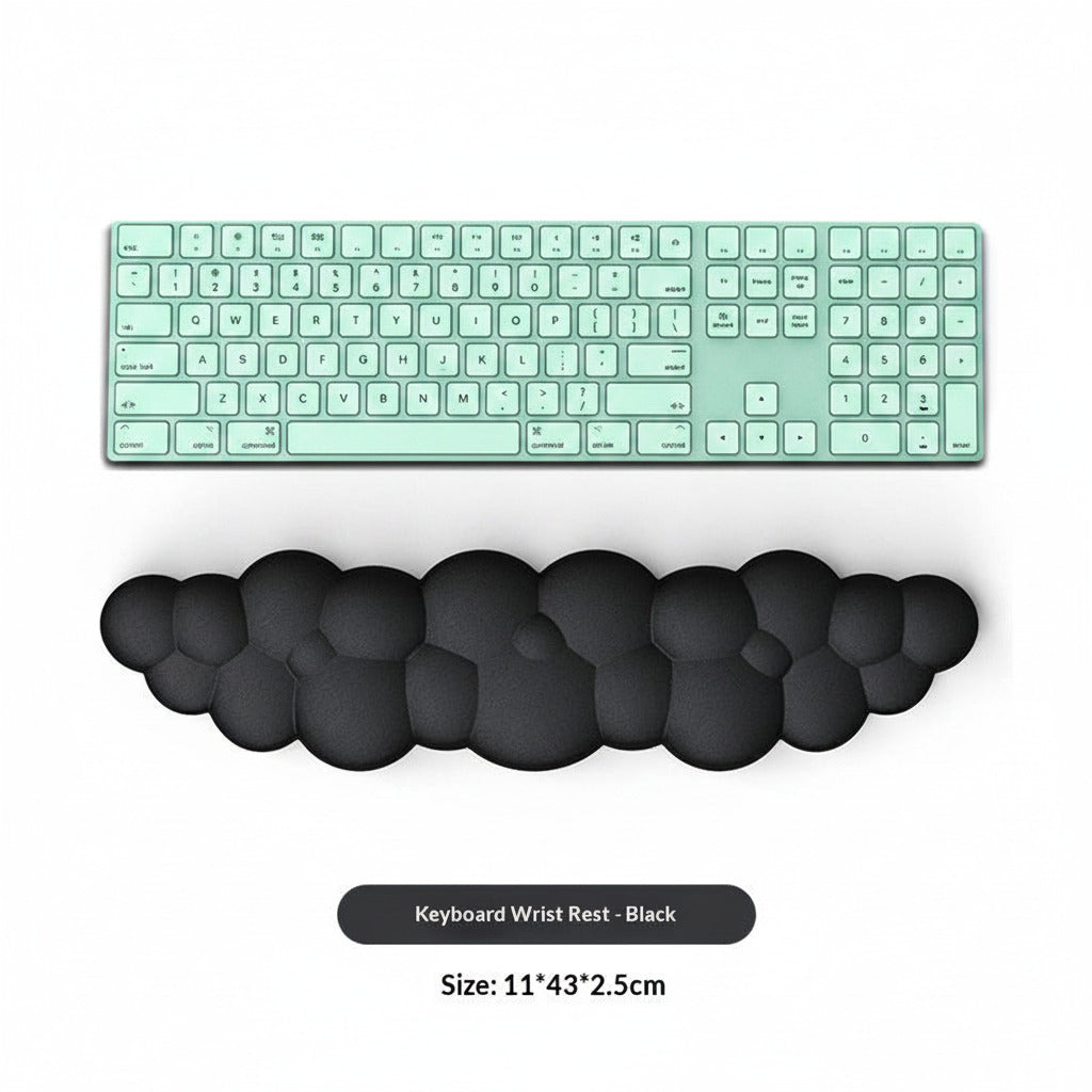 Black keyboard wrist rest with a computer keyboard on a white background