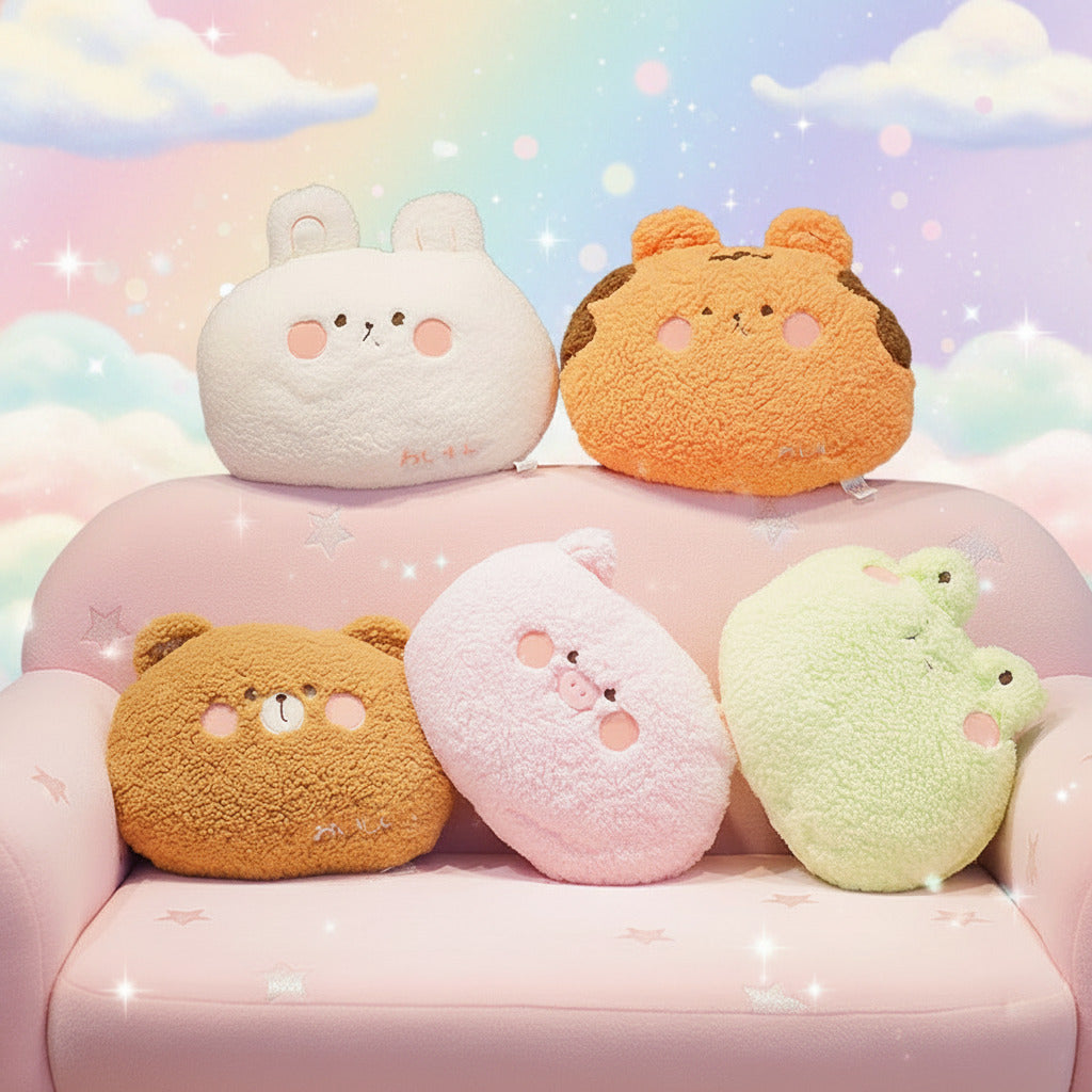 Five fluffy animal-shaped cushions in different colors on a light surface.