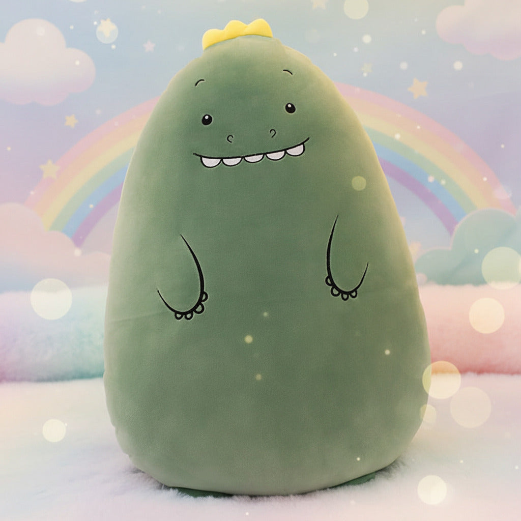 Green plush toy with cartoon face on a wooden floor