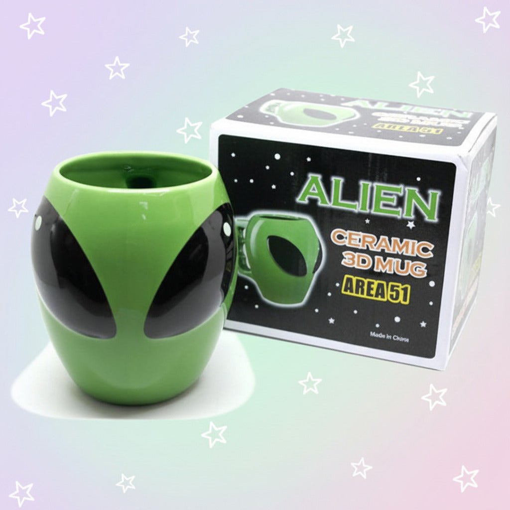 Green alien-shaped ceramic mug with packaging on a white background