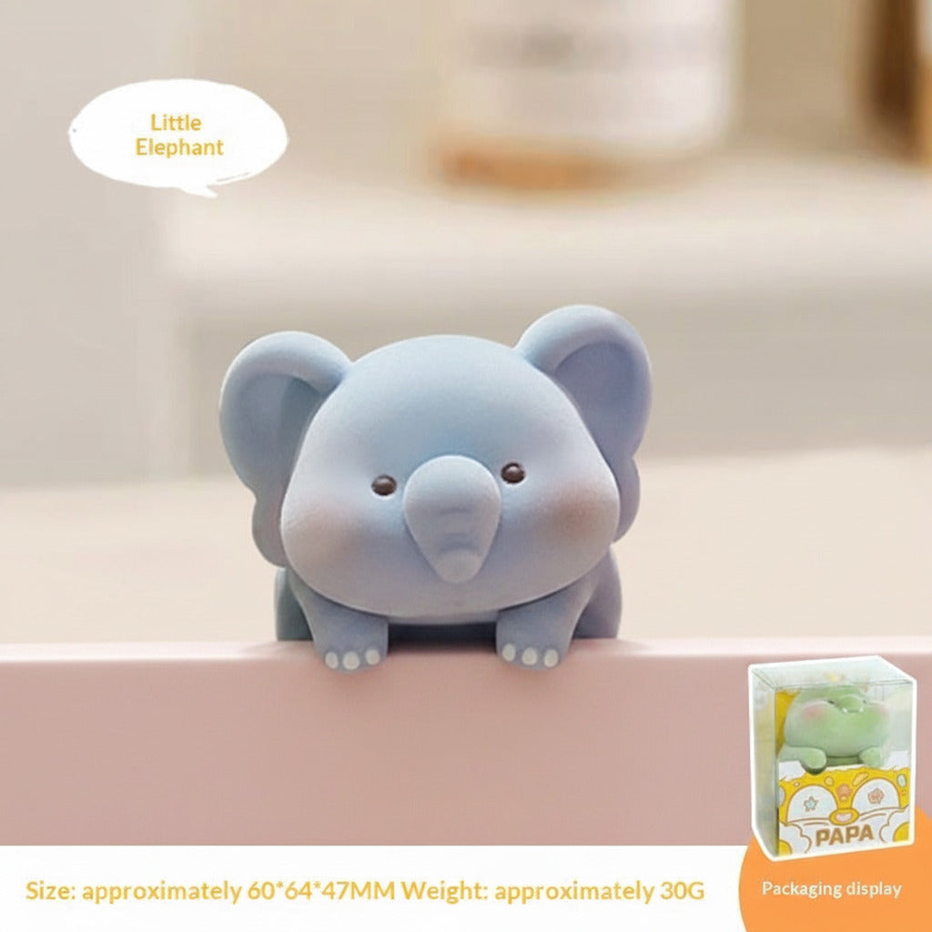 Blue elephant-shaped product with packaging display on a blurred background