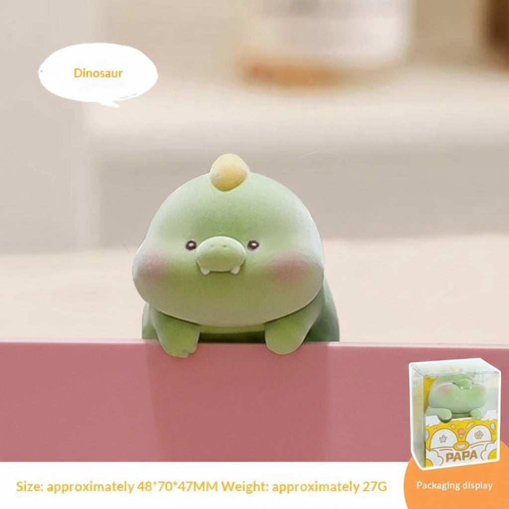 Green dinosaur plush toy with packaging display on a blurred background