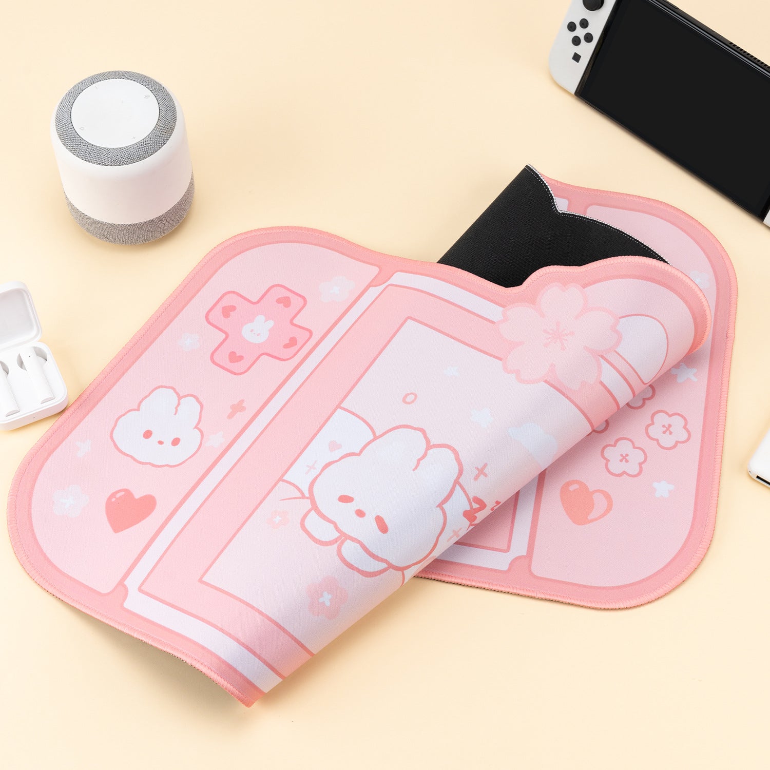 Pink and white mouse pad with cartoon character on a yellow surface