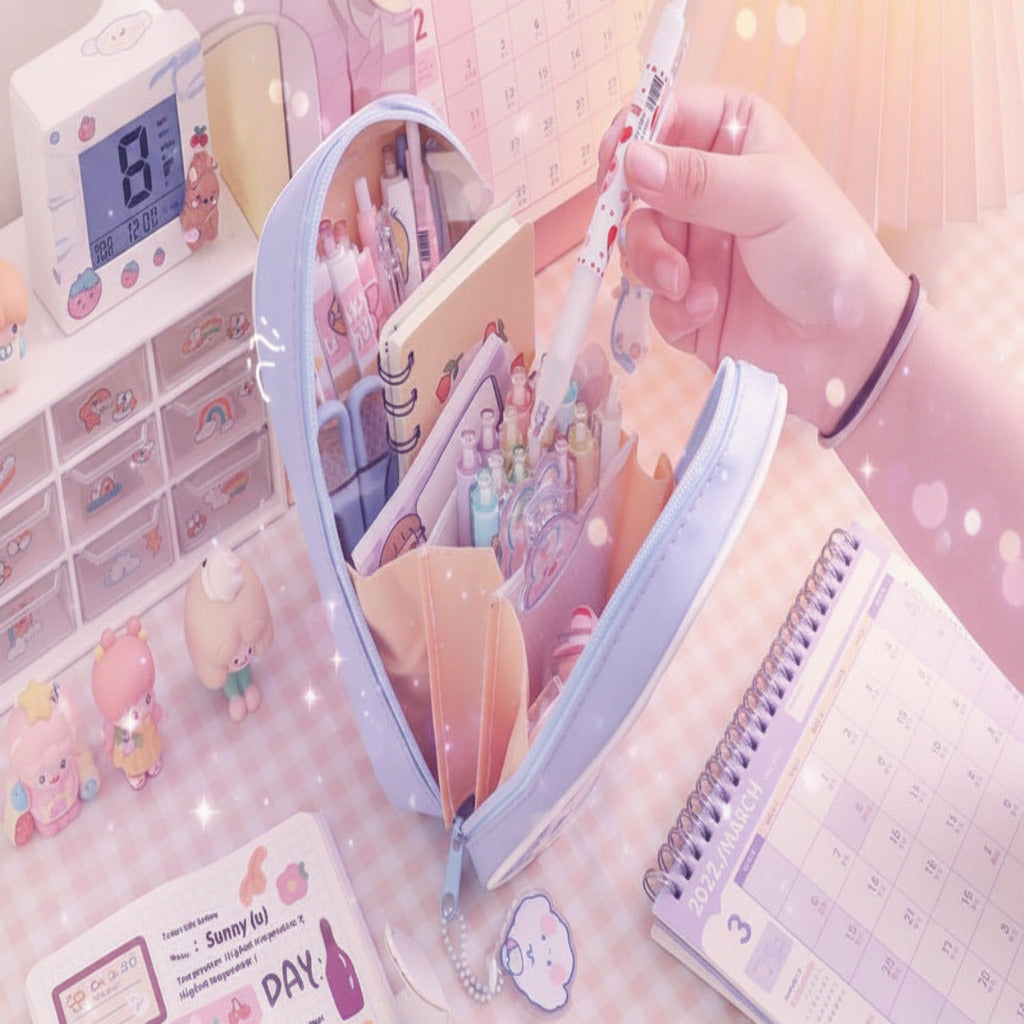 Cute kawaii cartoon stationery large-capacity pencil cases in pastel colors displayed on a desk with decorative accessories, perfect for organizing pens, pencils, markers, school supplies, and office stationery.