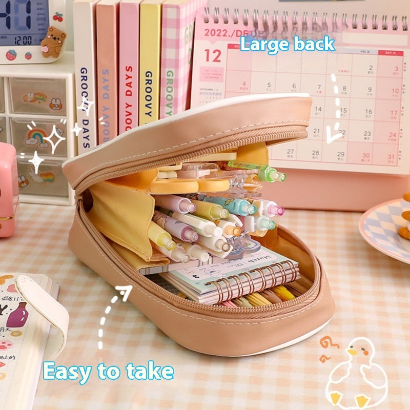 Cute kawaii cartoon stationery large-capacity pencil cases in pastel colors displayed on a desk with decorative accessories, perfect for organizing pens, pencils, markers, school supplies, and office stationery.