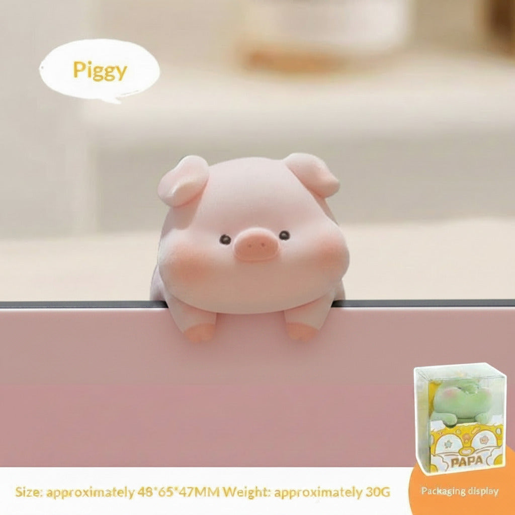 Pink pig plush toy with packaging display on a blurred background