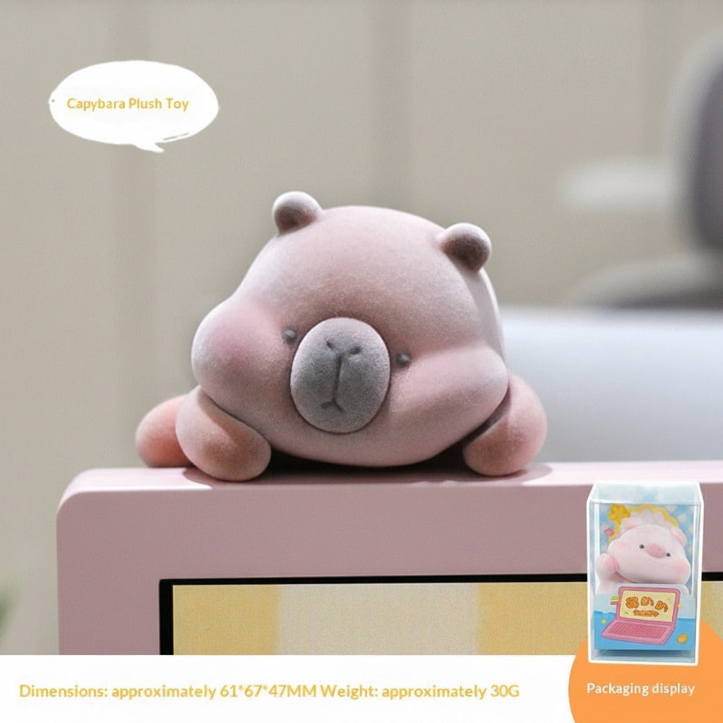 Plush capybara toy on a surface with packaging displayed below.