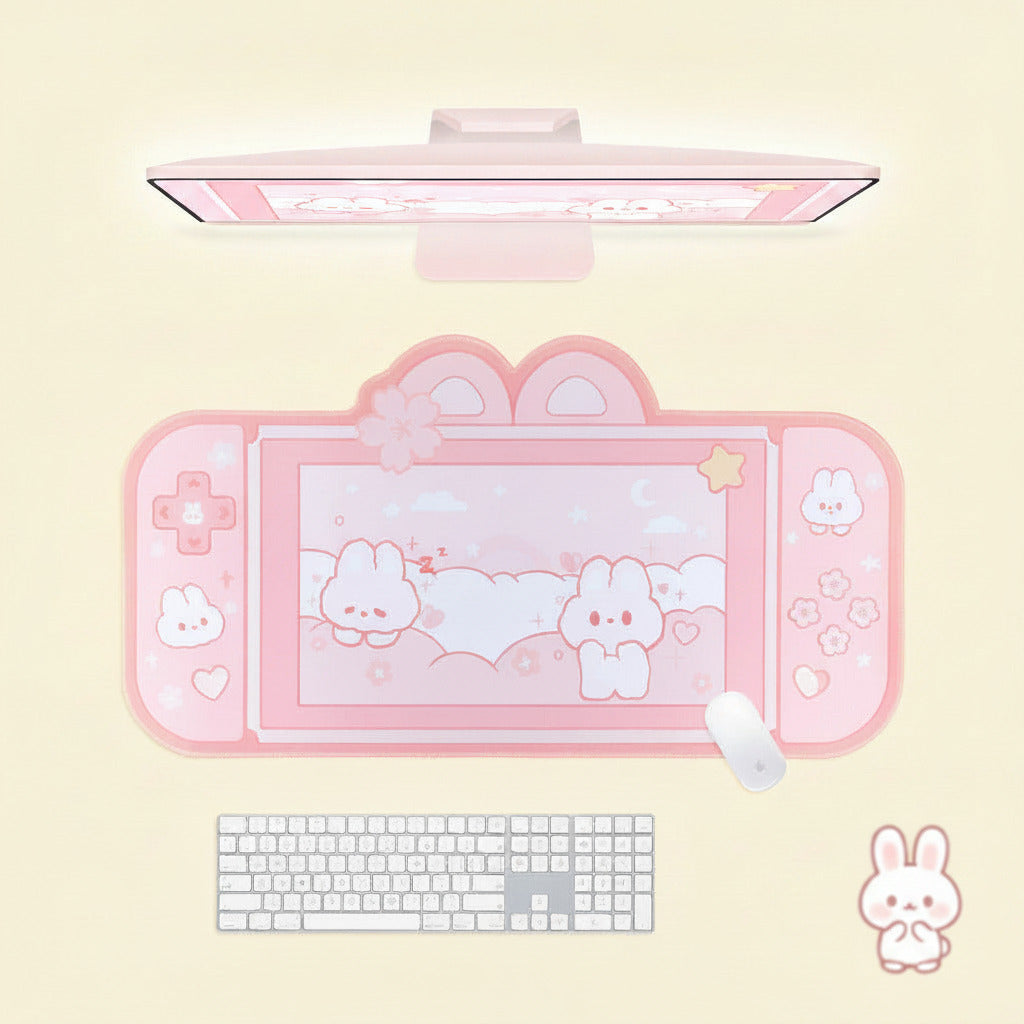Pink cartoon-themed desk mat with a keyboard and mouse on a light yellow background