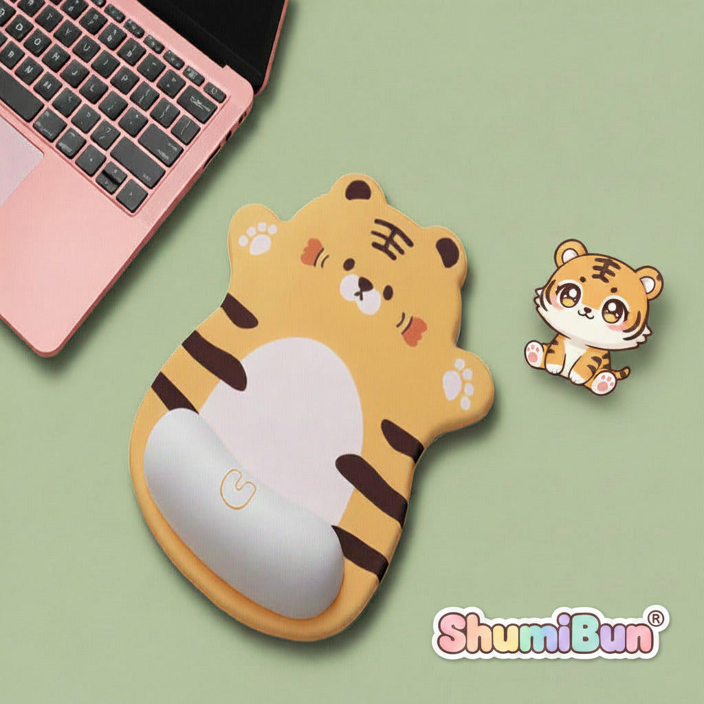 Cute tiger-shaped mouse pad next to a laptop on a yellow background