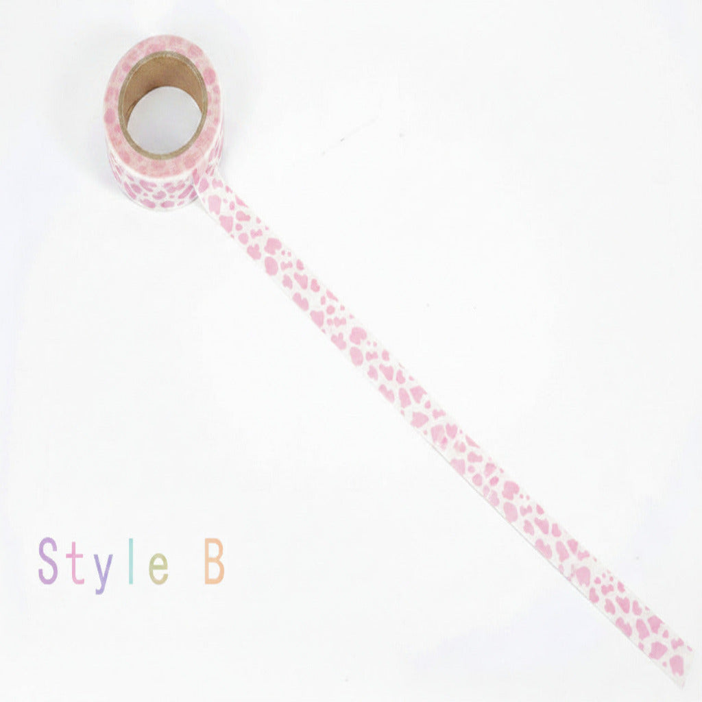 A roll of washi tape with a pink heart pattern on a white background, labeled 'Style B' in the lower left corner.