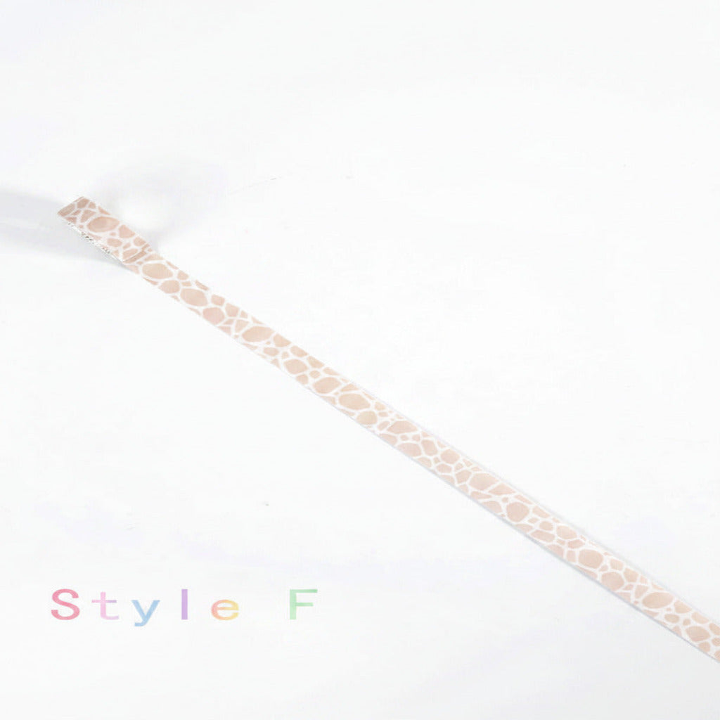 A single roll of washi tape with a light beige giraffe-like spot pattern on a white background, with the text 'Style F' printed in black at the bottom left.