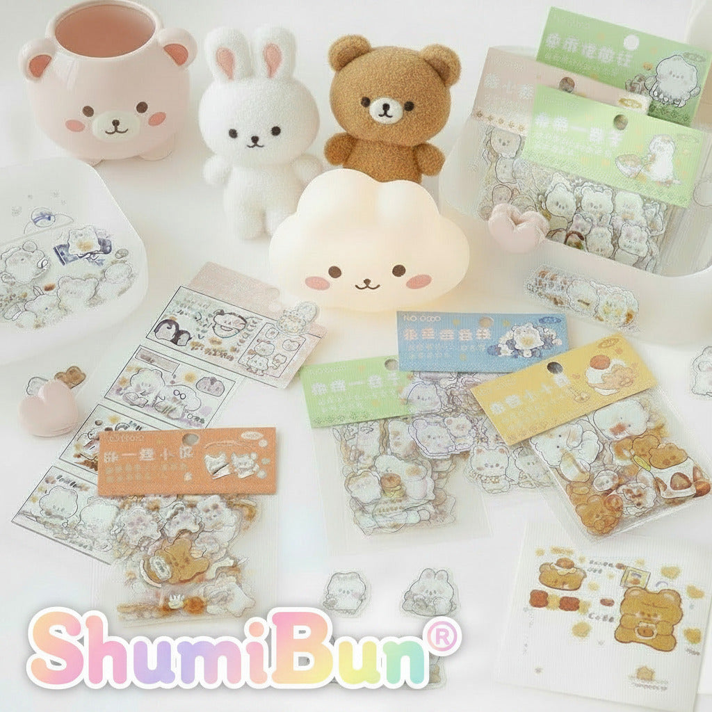 Collection of cute stationery items including stickers and a small lamp on a white surface.