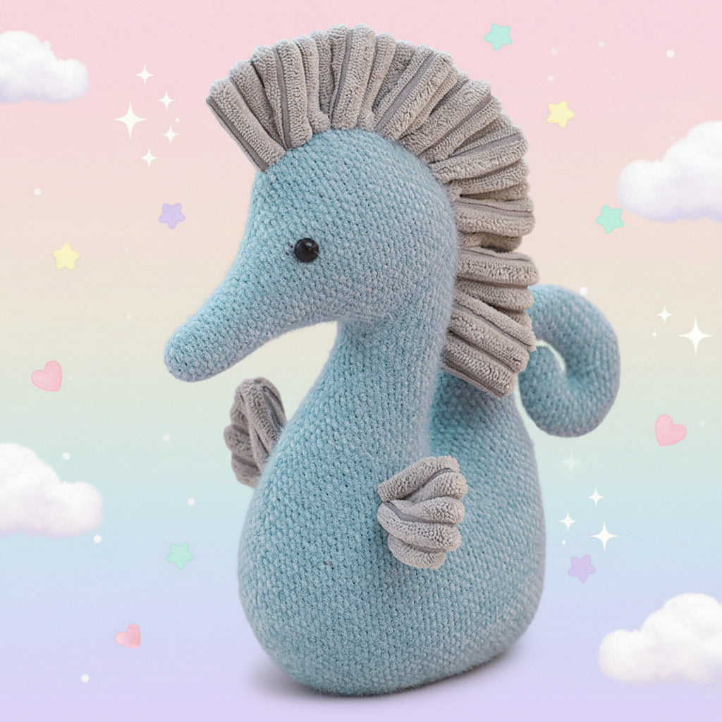 Knitted seahorse toy with a textured mane on a light background
