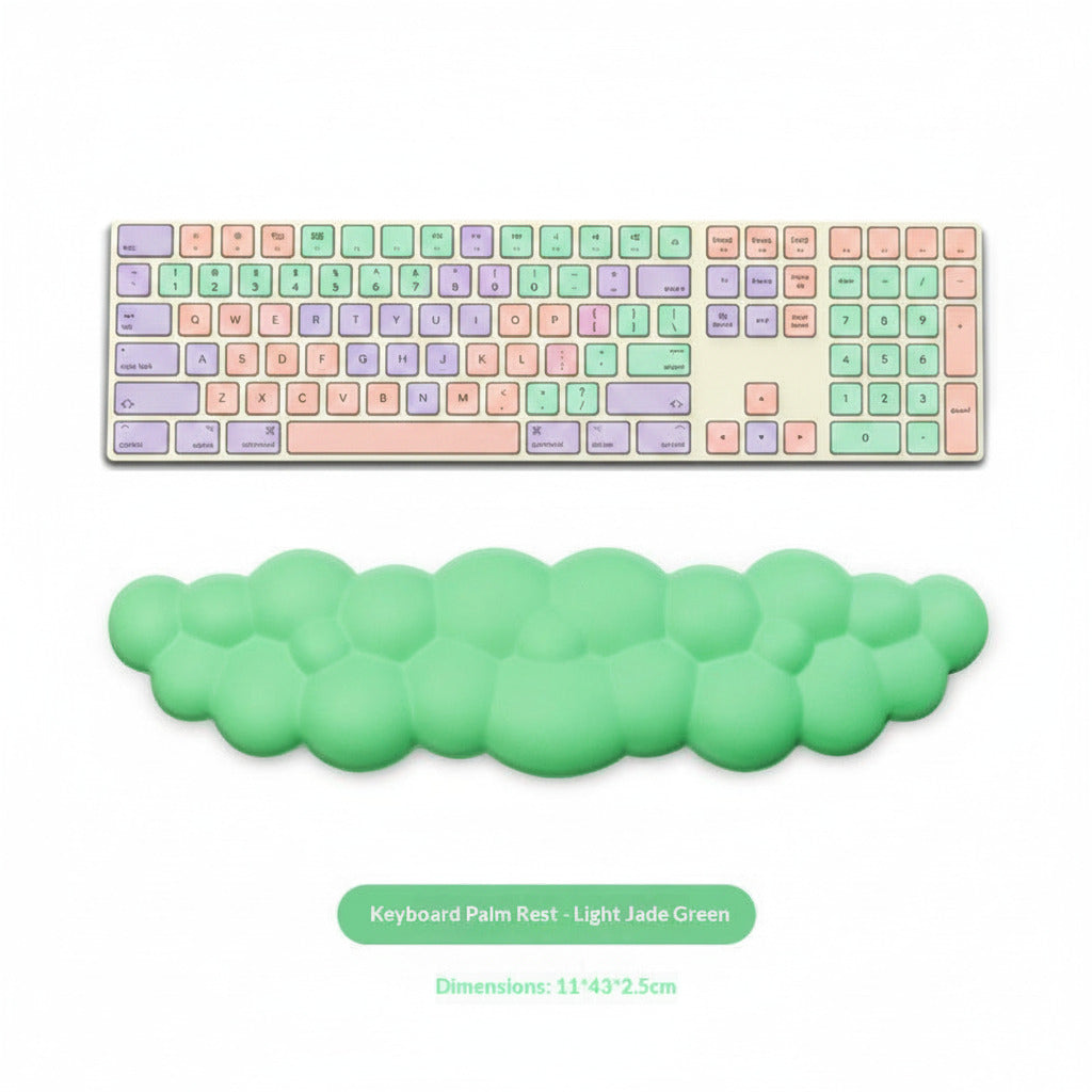 Green keyboard palm rest in front of a computer keyboard on a white background