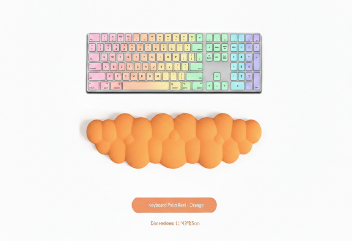 An orange bubble-style keyboard palm rest shown below a black wireless keyboard on a white background, with text reading 'Keyboard Palm Rest - Orange' and dimensions below.