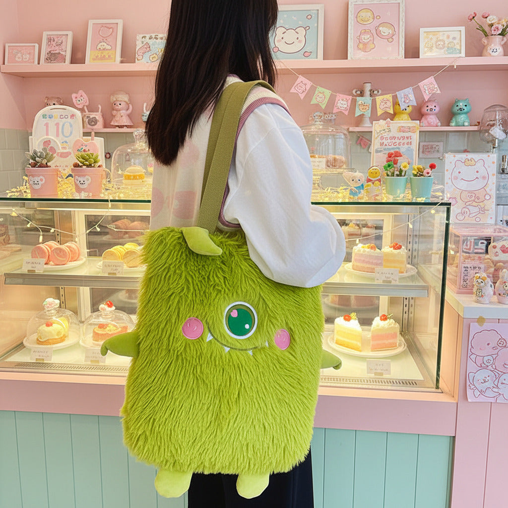 Person holding a green plush bag with cartoon face design in a kitchen setting