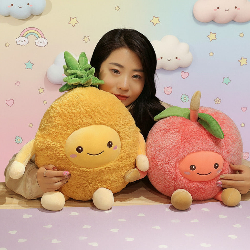 Person holding a plush pineapple and peach toy against a dark wall with framed pictures.