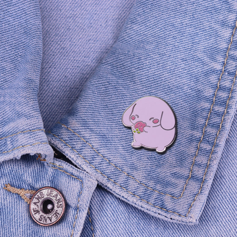 Pink cartoon bunny pin on a blue denim jacket