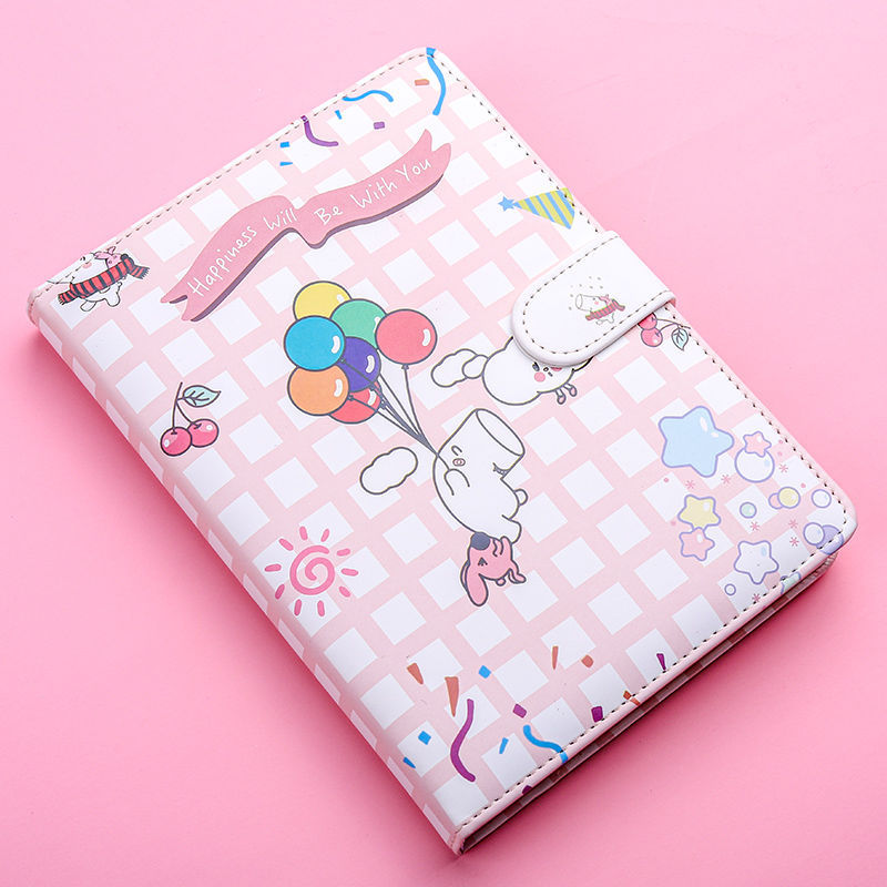Pink checkered notebook with cartoon design on a pink background