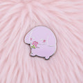 Purple cartoon character with a pink flower on a white background