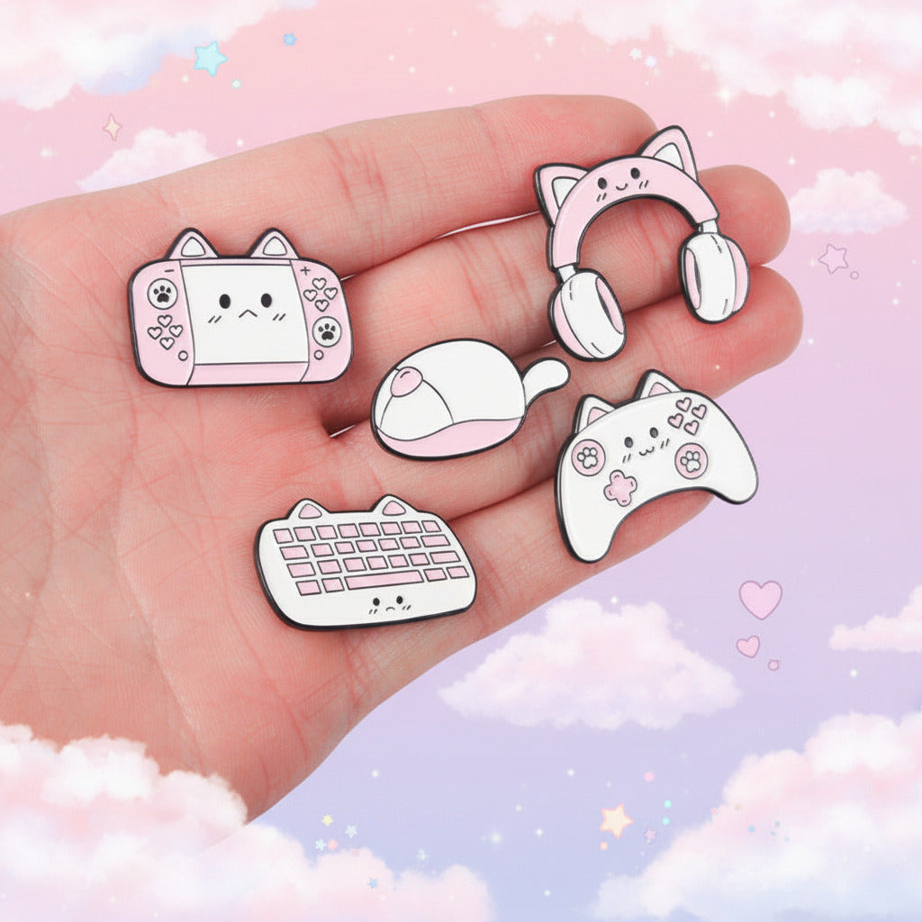 Set of cartoon-style pins shaped like gaming accessories on a hand.