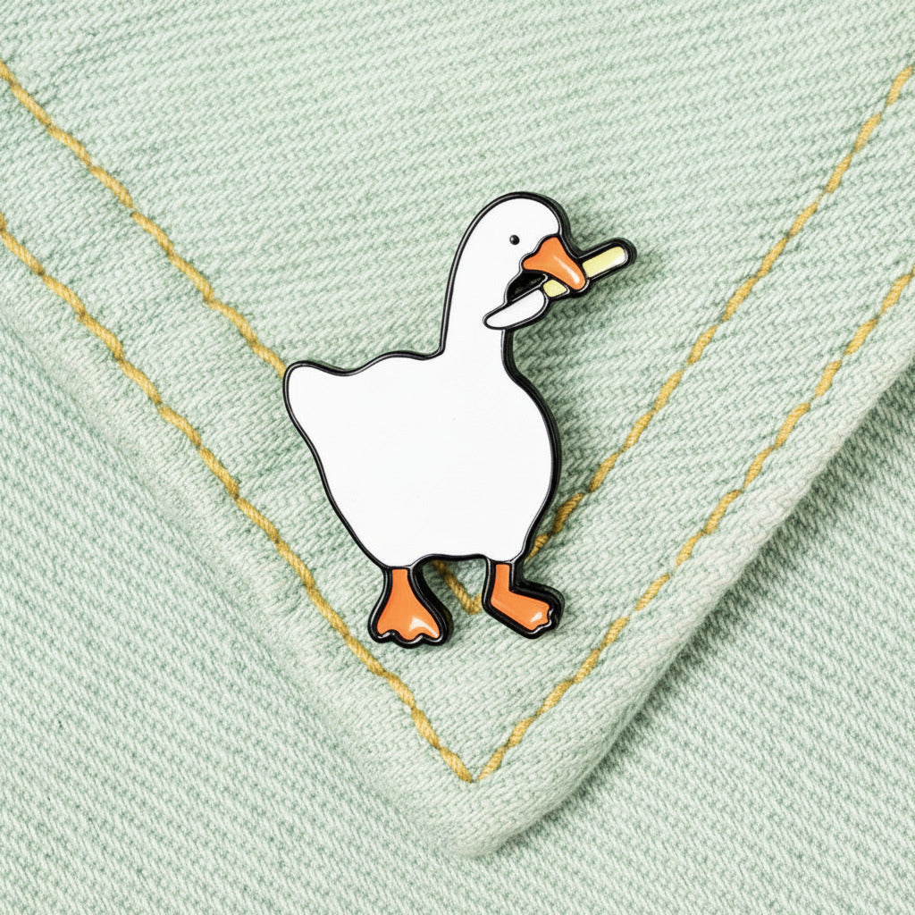 White duck pin on a denim fabric background
