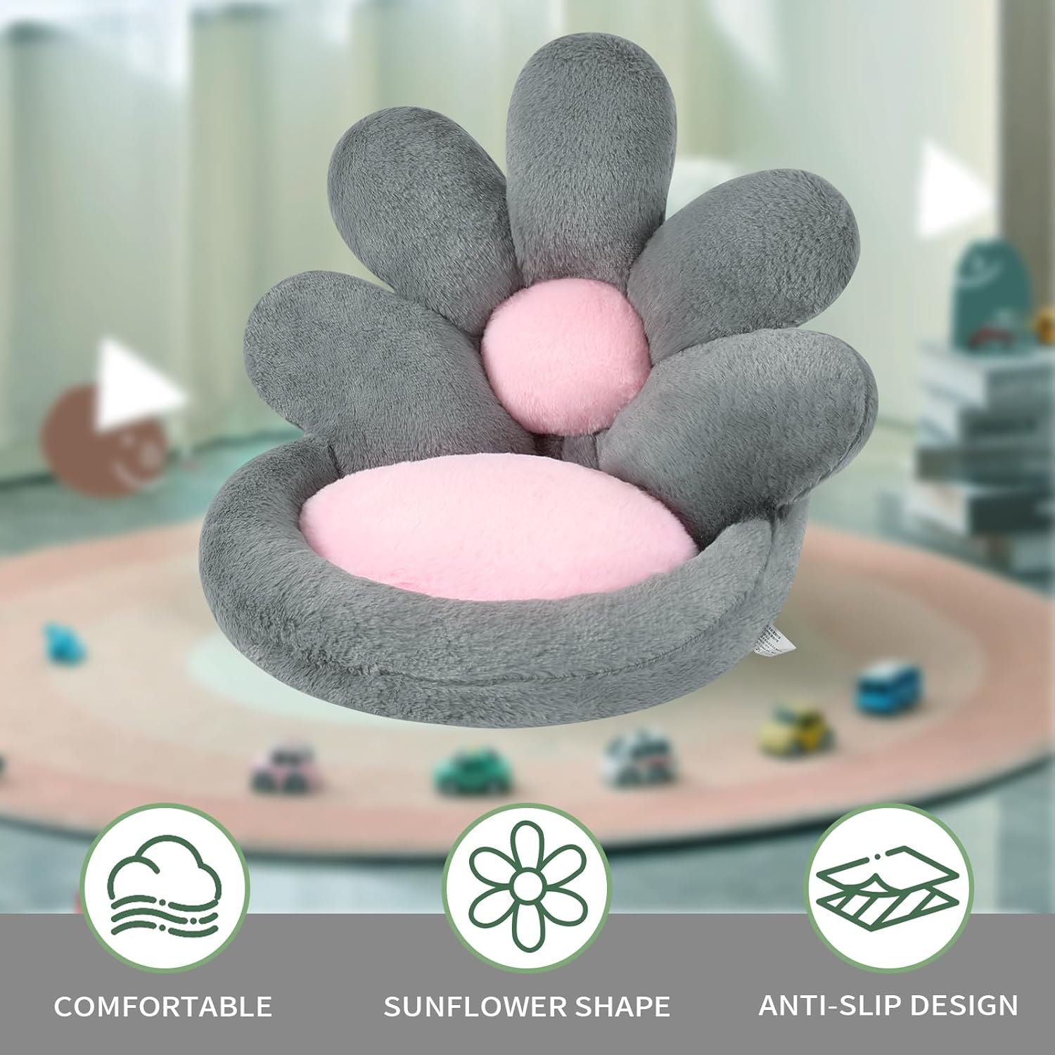 Gray sunflower-shaped pet bed with pink center on a blurred indoor background