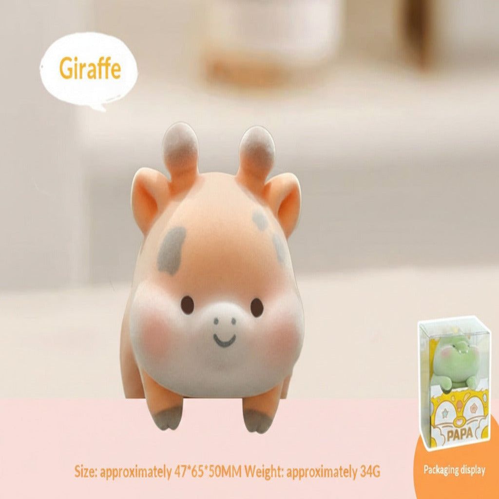 Plush giraffe toy with packaging display on a light background