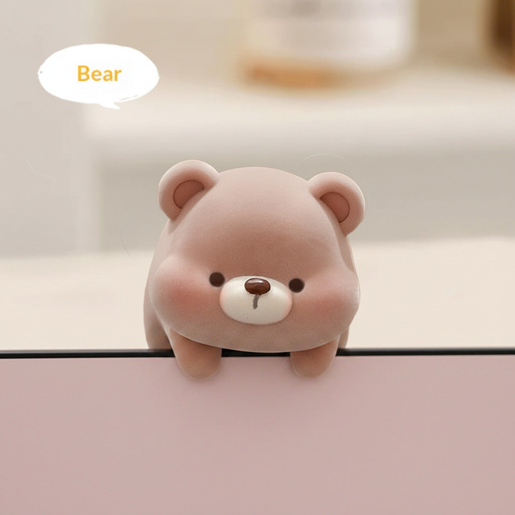Plush bear toy with packaging display on a light background