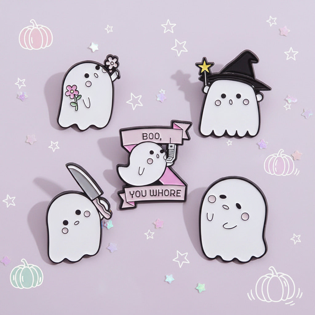 Five cute ghost-themed enamel pins arranged on a solid pink background. The designs include a ghost with a small bouquet, a witch ghost with a star wand, a smiling ghost, a ghost holding a knife, and a central ghost with a banner that reads 'BOO, YOU WHORE'.